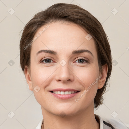 Joyful white young-adult female with medium  brown hair and grey eyes