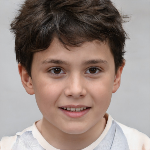 Joyful white child male with short  brown hair and brown eyes