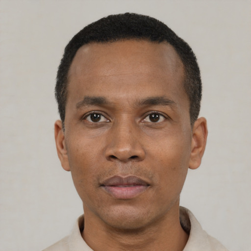Neutral black adult male with short  black hair and brown eyes
