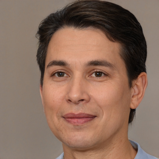 Joyful white adult male with short  brown hair and brown eyes