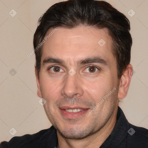 Joyful white adult male with short  brown hair and brown eyes