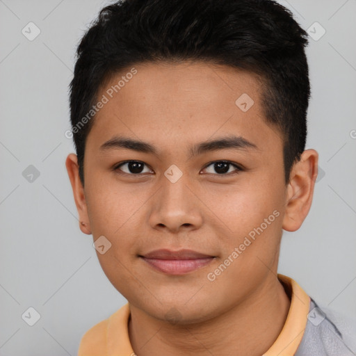 Joyful asian young-adult male with short  brown hair and brown eyes