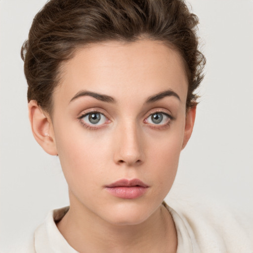 Neutral white young-adult female with short  brown hair and grey eyes