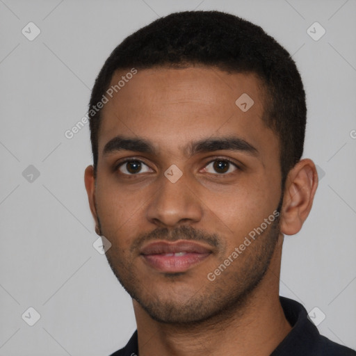 Joyful black young-adult male with short  black hair and brown eyes