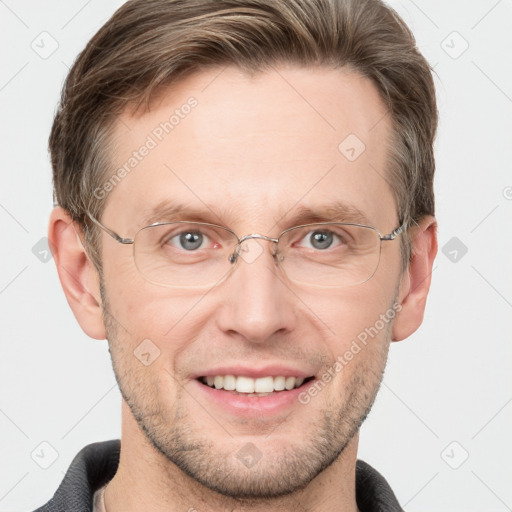 Joyful white adult male with short  brown hair and grey eyes