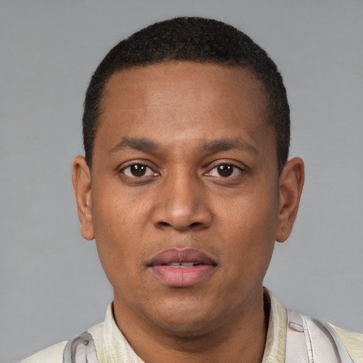 Neutral latino young-adult male with short  brown hair and brown eyes