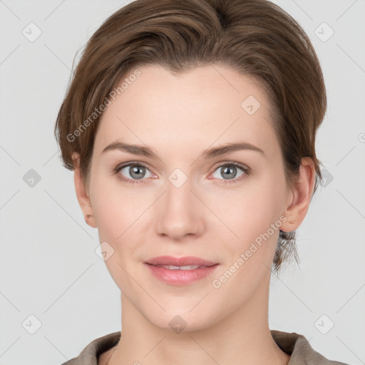 Joyful white young-adult female with short  brown hair and grey eyes