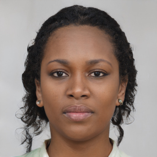 Neutral black young-adult female with long  black hair and brown eyes