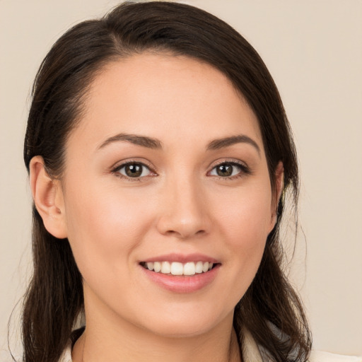 Joyful white young-adult female with medium  brown hair and brown eyes