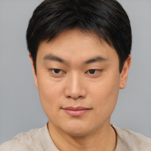 Neutral asian young-adult male with short  brown hair and brown eyes