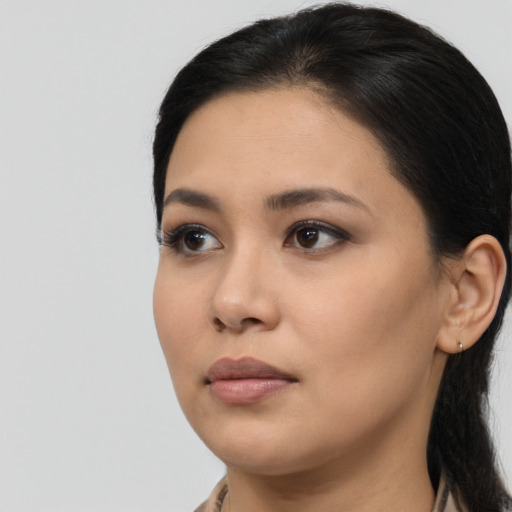 Neutral latino young-adult female with long  brown hair and brown eyes