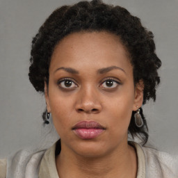 Neutral black young-adult female with short  black hair and brown eyes