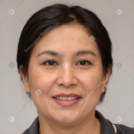 Joyful white adult female with medium  brown hair and brown eyes