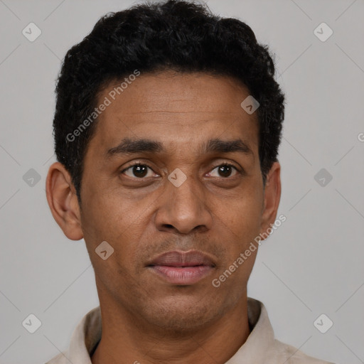 Neutral latino adult male with short  black hair and brown eyes