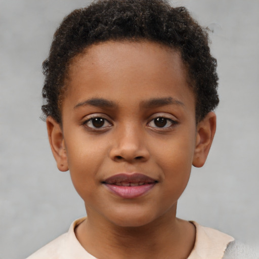 Joyful black child female with short  brown hair and brown eyes