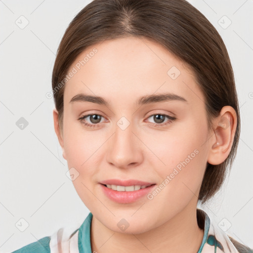 Joyful white young-adult female with medium  brown hair and grey eyes