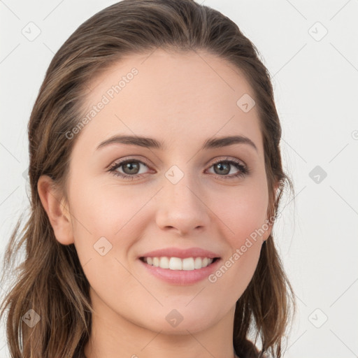 Joyful white young-adult female with long  brown hair and grey eyes