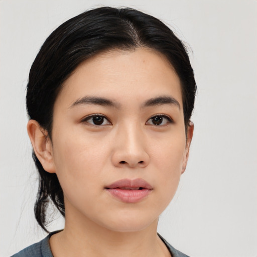Neutral asian young-adult female with medium  black hair and brown eyes