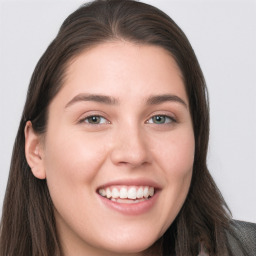 Joyful white young-adult female with long  brown hair and grey eyes