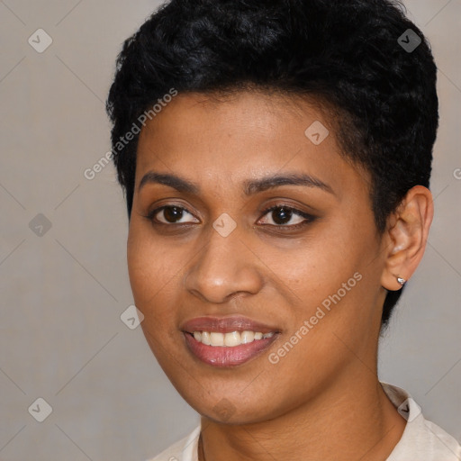 Joyful black young-adult female with short  black hair and brown eyes