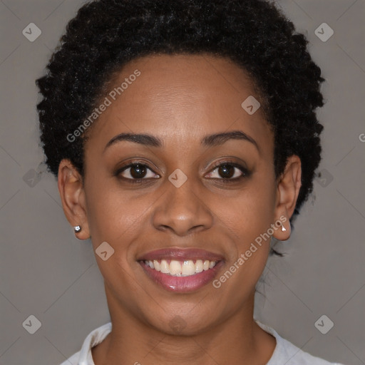 Joyful black young-adult female with short  brown hair and brown eyes