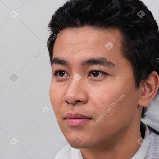 Neutral asian young-adult male with short  black hair and brown eyes