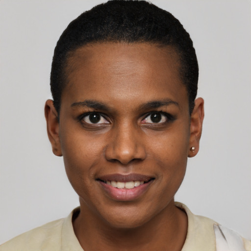 Joyful black young-adult female with short  brown hair and brown eyes