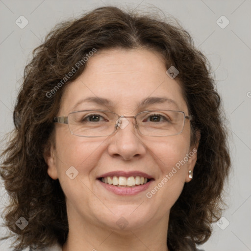 Joyful white adult female with medium  brown hair and green eyes