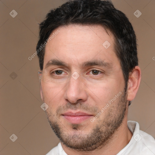 Joyful white adult male with short  brown hair and brown eyes