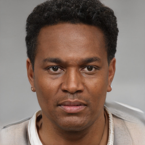 Neutral black young-adult male with short  brown hair and brown eyes