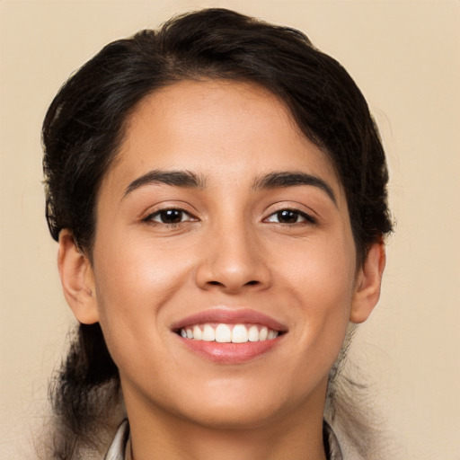 Joyful white young-adult female with long  brown hair and brown eyes