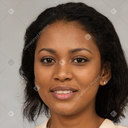 Joyful black young-adult female with long  brown hair and brown eyes