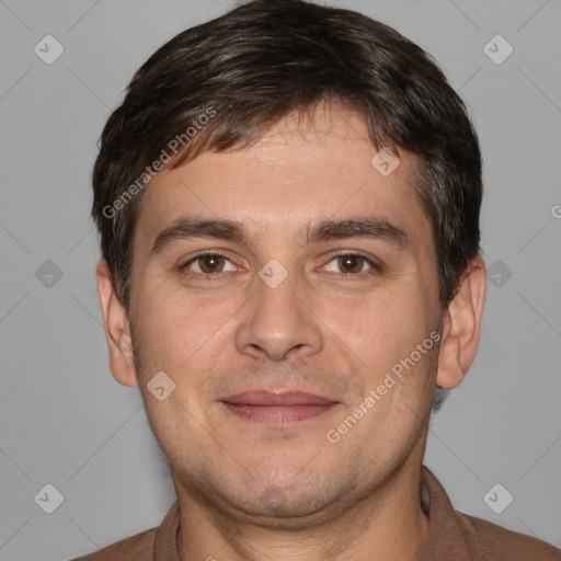 Joyful white adult male with short  brown hair and brown eyes