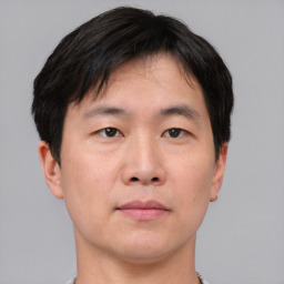 Neutral asian young-adult male with short  brown hair and brown eyes