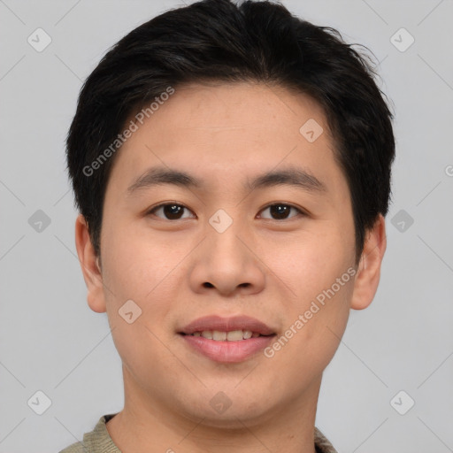 Joyful asian young-adult male with short  brown hair and brown eyes