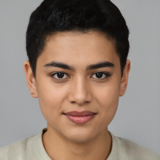 Joyful latino young-adult female with short  brown hair and brown eyes