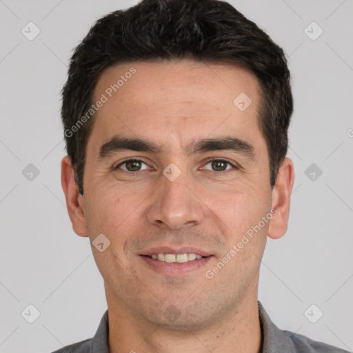 Joyful white young-adult male with short  black hair and brown eyes