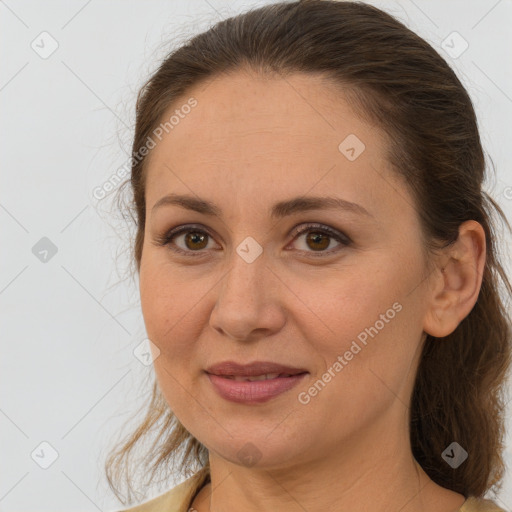 Joyful white adult female with medium  brown hair and brown eyes