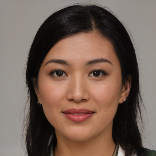 Joyful asian young-adult female with medium  brown hair and brown eyes