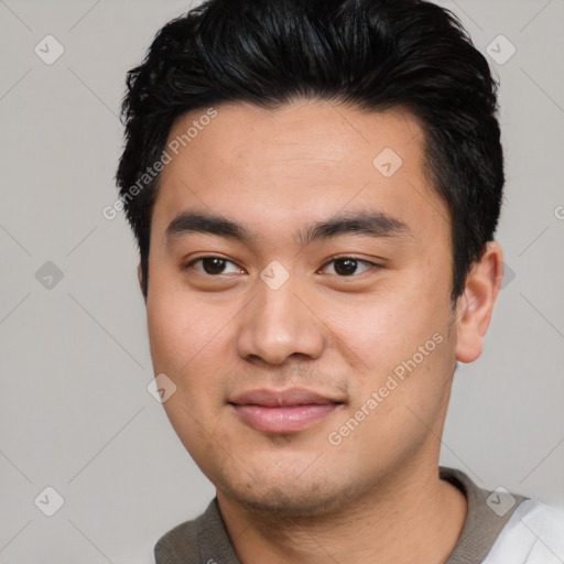 Joyful asian young-adult male with short  black hair and brown eyes