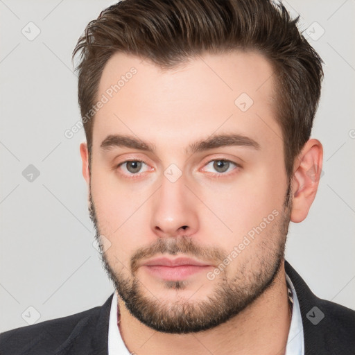 Neutral white young-adult male with short  brown hair and brown eyes