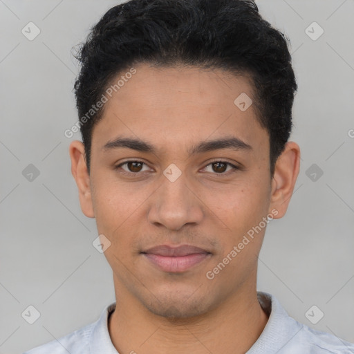 Joyful latino young-adult male with short  black hair and brown eyes