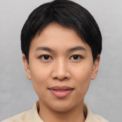Joyful asian young-adult female with short  black hair and brown eyes