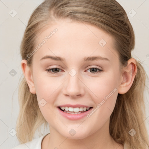 Joyful white young-adult female with long  brown hair and blue eyes