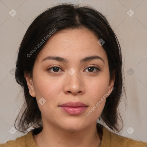 Joyful latino young-adult female with medium  brown hair and brown eyes