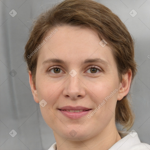 Joyful white adult female with short  brown hair and grey eyes