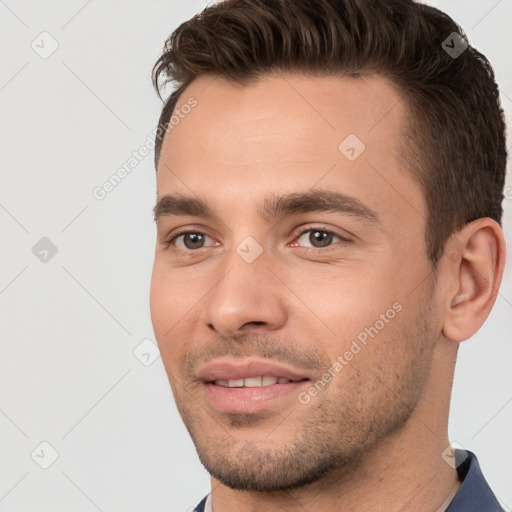 Joyful white young-adult male with short  brown hair and brown eyes