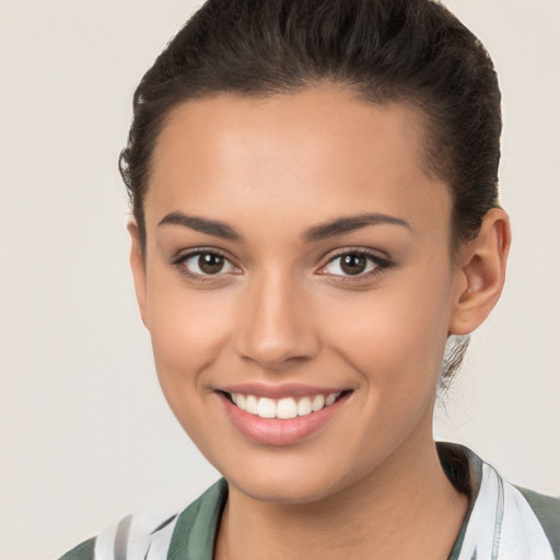 Joyful latino young-adult female with long  brown hair and brown eyes