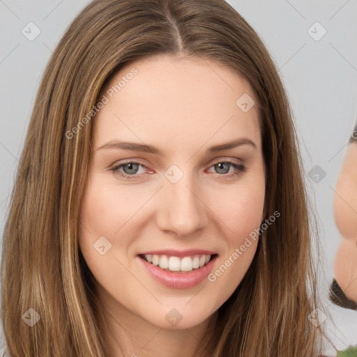 Joyful white young-adult female with long  brown hair and grey eyes