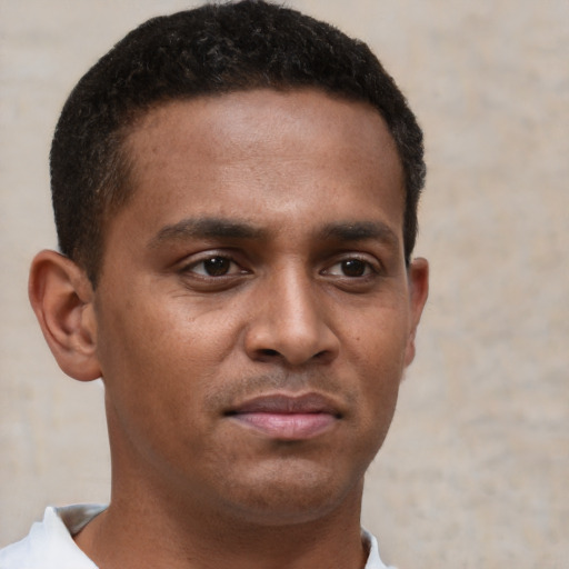 Neutral black young-adult male with short  brown hair and brown eyes